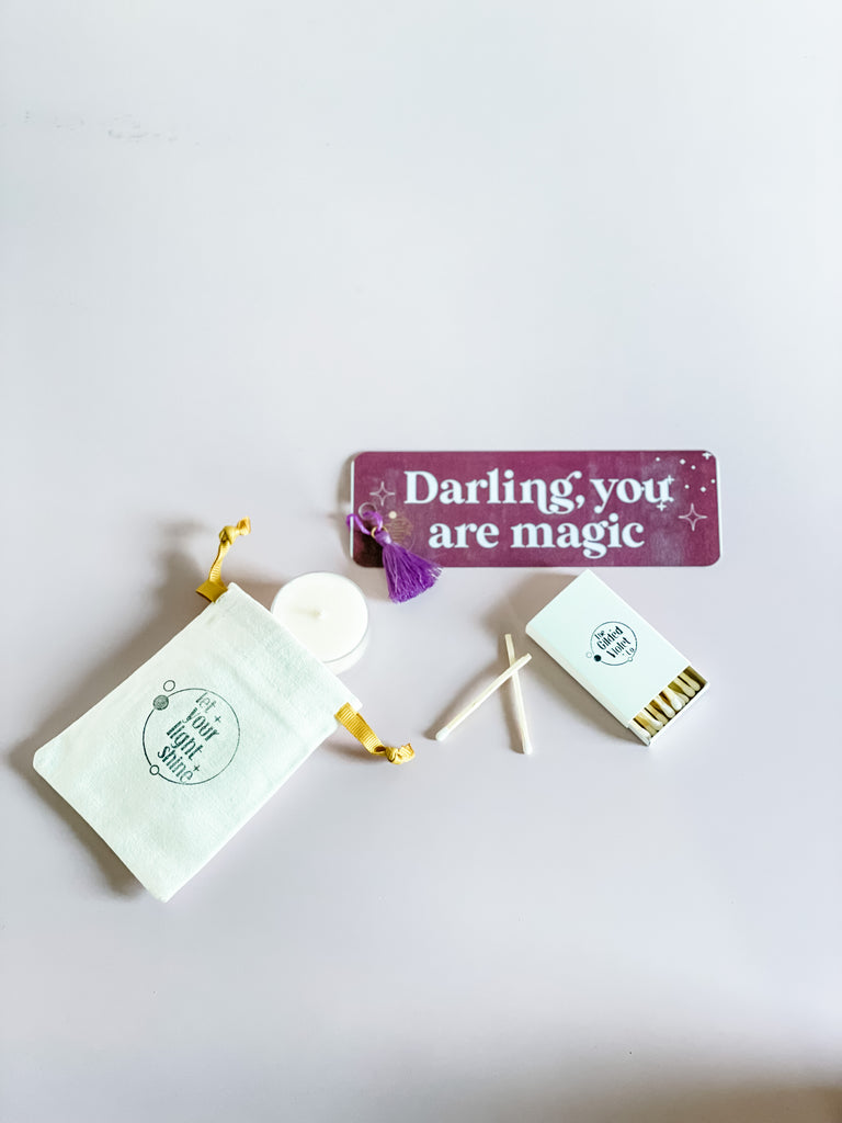 free tealight, bookmark, bag, and matches with purchase